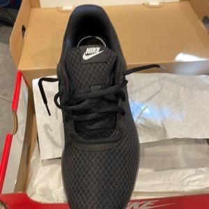 Brand new. In box. Women’s Nike comfort sneakers. Black.